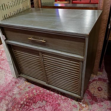 Green blue painted cabinet with a drawer and sliding door. 30” x 18” x 29” 