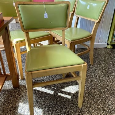 Four groovy green vinyl and wood chairs.  4 available 17.5” x 16.5” x 32” seat height 17.5”