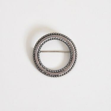 Vintage Come Full Circle brooch 