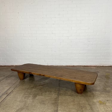 Theo” Primitive Coffee Table by Penny Six- Light Stain 