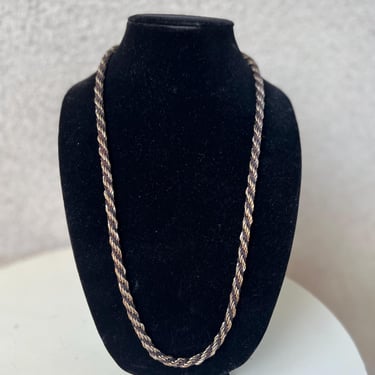 Vintage necklace twisted chain gold tone with black rope drop 14”. 