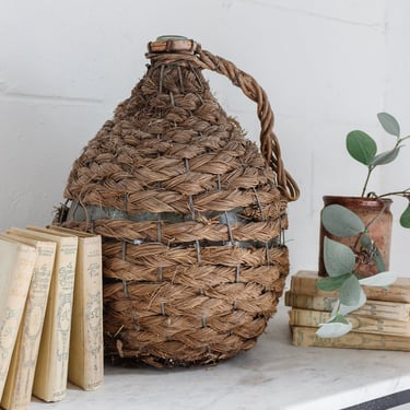 antique french wicker wrapped demijohn