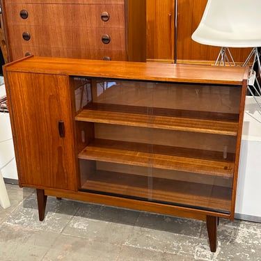 Teak wood cabinet with one door, two sliding glass doors and shelves