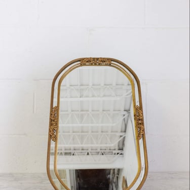 vintage rounded gold metal dresser mirror