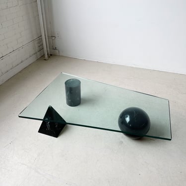 TRAPEZOID GLASS COFFEE TABLE WITH GEOMETRICAL BASE