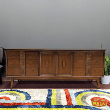 Mid-Century Modern walnut 9-drawer dresser from the Mayan collection by Bassett