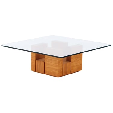 A bleached mahogany glass top coffee table in the manner of Paul Evans, C. 1980.