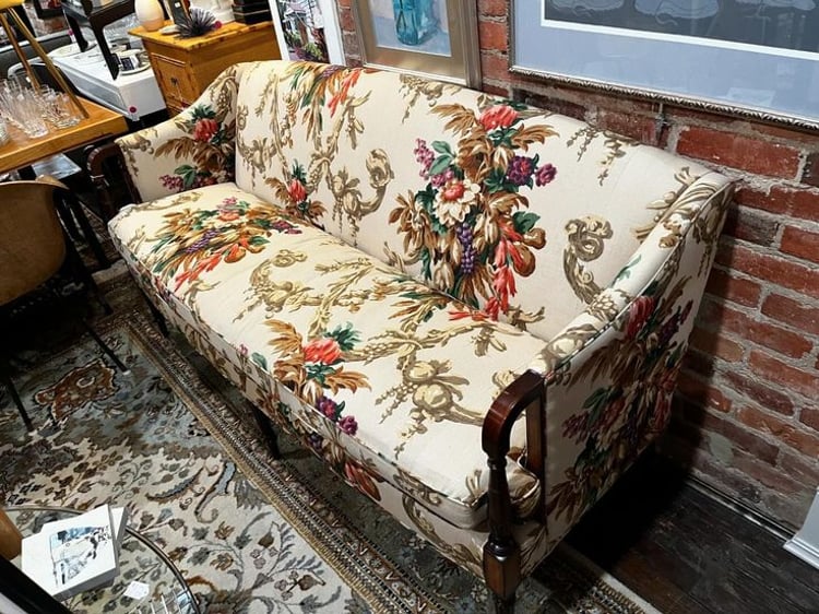 Floral upholstered mahogany sofa. 69” x 28” x 34” seat height 20” Call 202-232-8171 to purchase