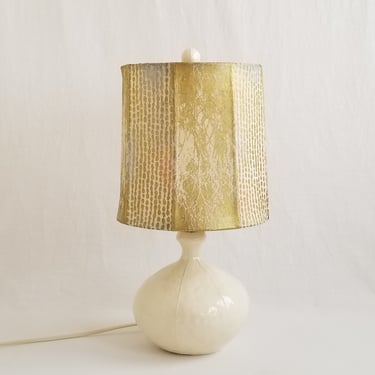 White ceramic table lamp. Custom gold and silver handmade paper shade. Matching finial 