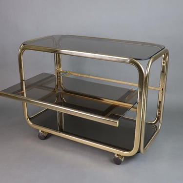 1970s Vintage Bar Cart | Smoked Glass Serving Trolley | Gold-Colored Metal Frame | Mid-Century Modern Furniture 
