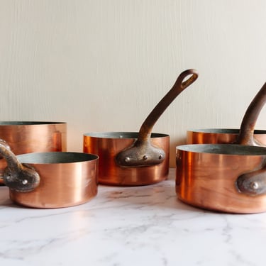 vintage French stamped graduated copper saucepans, set of 5