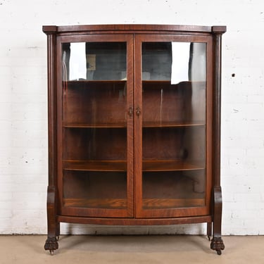 R. J. Horner Style Antique American Empire Oak Bow Front Bookcase Cabinet With Lion&#8217;s Paw Feet, Circa 1890