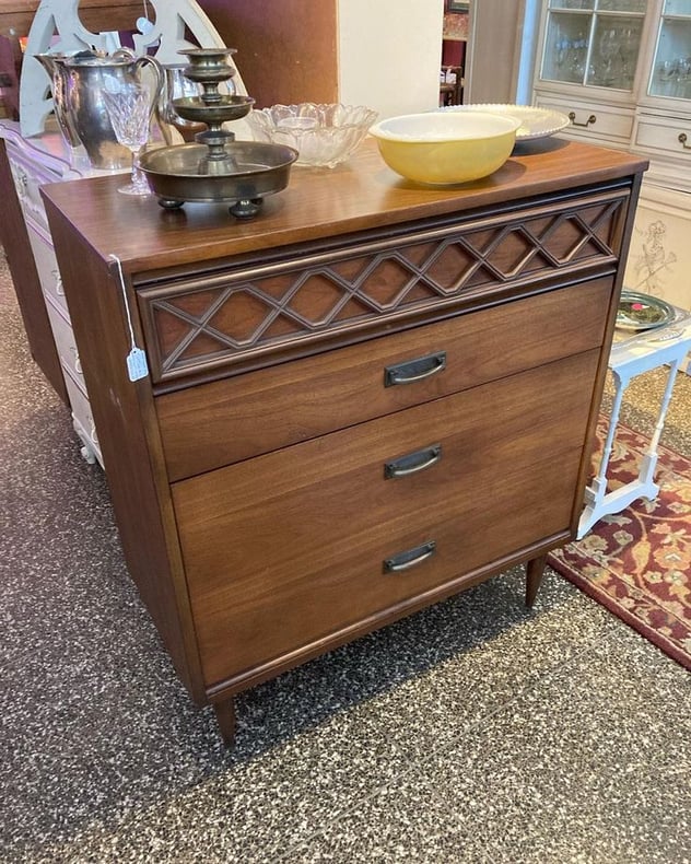 MCM walnut chest of drawers with laminate top. 42”x18”x37” To purchase call 202-232-8171.