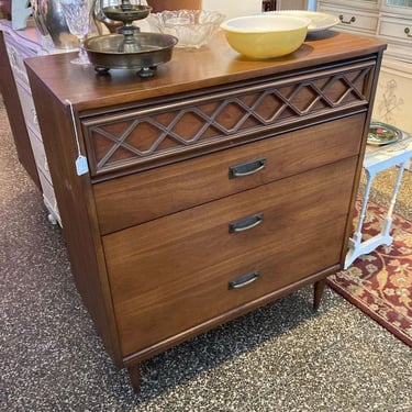 MCM walnut chest of drawers with laminate top. 42”x18”x37” To purchase call 202-232-8171.