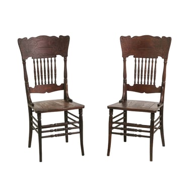 Pair of Antique Dark Stained Oak Press Back Chairs with Carved Details