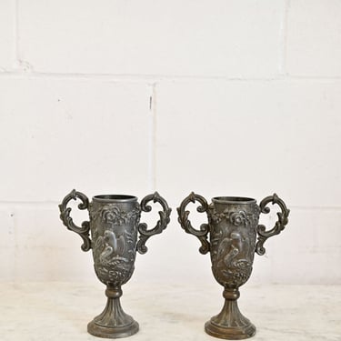 pair of vintage french cast metal trophies