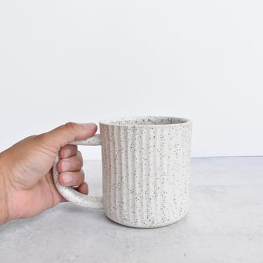 Fluted Ceramic Mug in speckled clay in white 