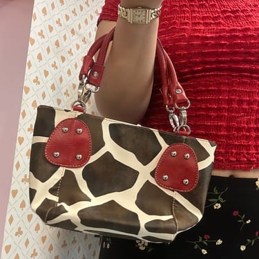 Cow Print Handbag with Red Accents