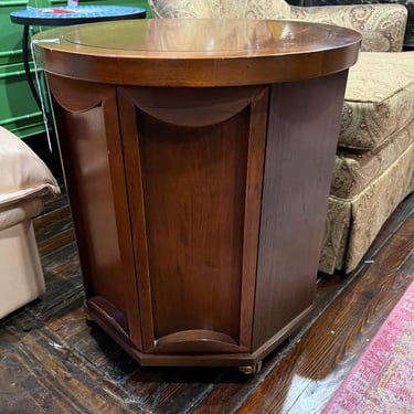 Round walnut side table with a secret door and wheels! 19” across 21” tall 