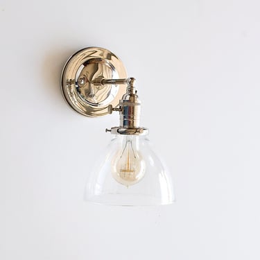 Wall sconce lighting with clear glass dome shade 