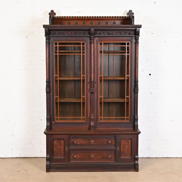 Herter Brothers Style Eastlake Victorian Carved Walnut and Burl Wood Bookcase, Circa 1860s