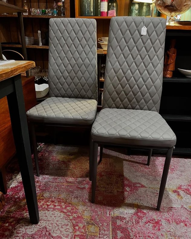 Quilted gray vinyl high backed chairs. 4 available. 16” x 17” x 38” seat height 17.5” 