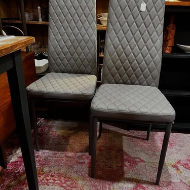 Quilted gray vinyl high backed chairs. 4 available. 16” x 17” x 38” seat height 17.5” 