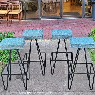 SET OF FOUR IRON BARSTOOLS AFTER FREDERICK WEINBERG