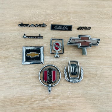 Vintage Original Automotive Parts 1980s 1990s Emblem Badge Oldsmobile Chevy Chevrolet Malibu Pontiac Grand Prix Cadillac DeVille - Lot of 9 