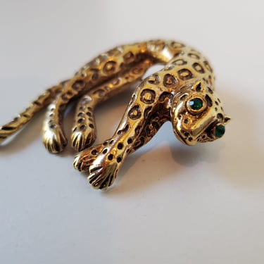 Vintage leopard gold tone with green eyes moving tail,1980's 