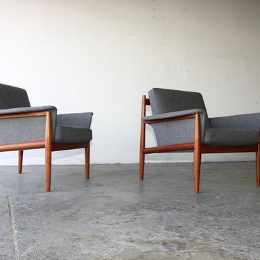 Pair of  Danish Mid Century Modern model 168 Grete Jalk teak lounge chairs with upholstered armrests 