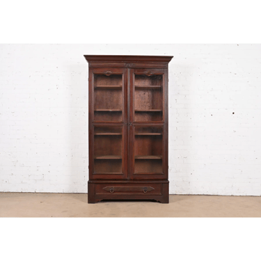 Herter Brothers Style Antique Eastlake Victorian Carved Walnut Bookcase Cabinet, Circa 1880s