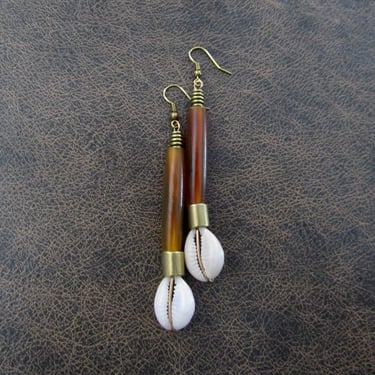 Long orange horn and cowrie shell earrings 