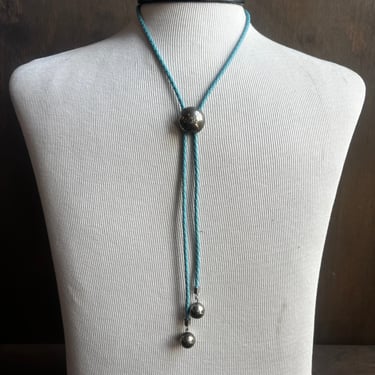 Silver Circle Bolo on Blue Cord