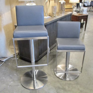PAIR OF CHROME AND GREY LEATHER ADJUSTABLE BARSTOOLS