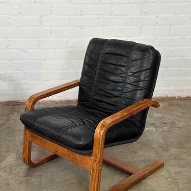 Bentwood black leather lounge chairs -sold separately 
