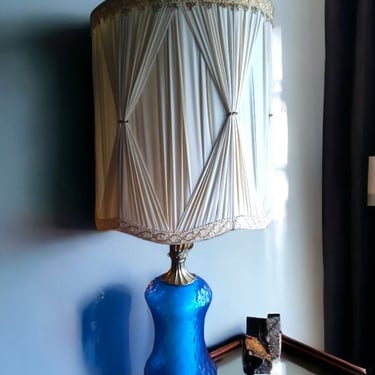 VINTAGE elegance meets Mid Century charm in a blue glass lamp Iconic Mid Century Modern design Retro-chic blue glass lighting 