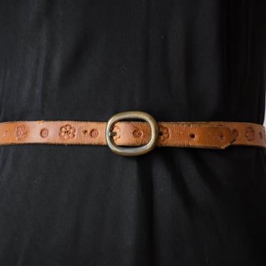 tooled leather belt | 70s vintage tan light brown boho hippie skinny floral stamped leather belt 