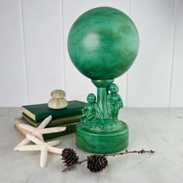 Antique Art Deco sculpture with Plinth Base two Cherubs and Sphere or Globe top, hand painted green black glaze for fireplace mantle shelf 
