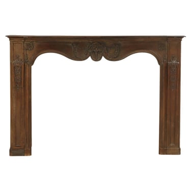 A French Carved Oak Fireplace Mantel, 18th C.