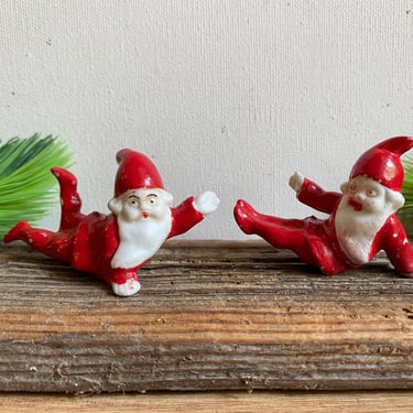 Vintage German Mini Ceramic Santa Set Of 2,  Playful Santa Elves Made In Germany, Slipping On Ice, Action Santas 
