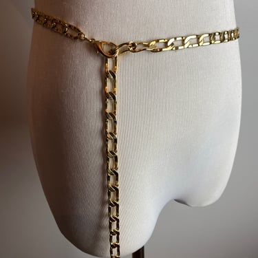 Vintage Gold slinky metal belt Mesh chain link waist chain glossy bright golden shiny skinny thin belts 1960’s 1970’s  size M/LG 