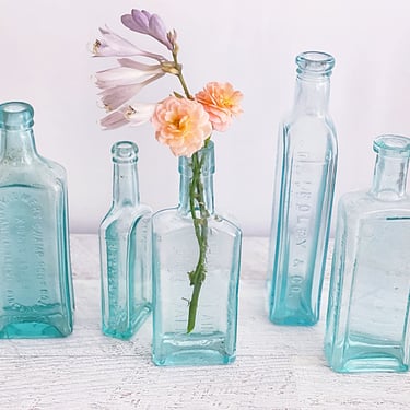 Blue glass apothecary bottles, 5 Embossed quack medicine pharmacy bottles, French farmhouse chic shelf decor bottle vases 