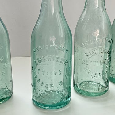4 Antique embossed American Bottling Co green glass bottles Dover NJ. 7 Ounce vintage soda / pop bottles 