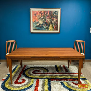 Danish Modern teak draw-leaf dining table by Niels Otto Møller for J.L. Møller