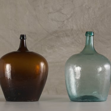 EARLY 20TH C HANDBLOWN 'DAMA JUANA' MEZCAL BOTTLE(S)