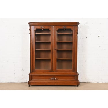 Herter Brothers Style Antique Victorian Carved Walnut Glass Front Bookcase, Circa 1880s