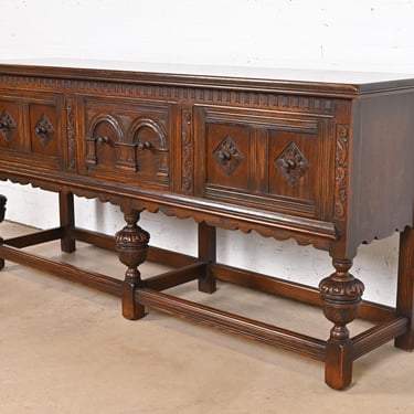 Baker Furniture English Jacobean Ornate Carved Oak Sideboard or Credenza, Circa 1920s