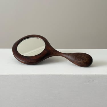 Vintage sculptural walnut hand mirror 