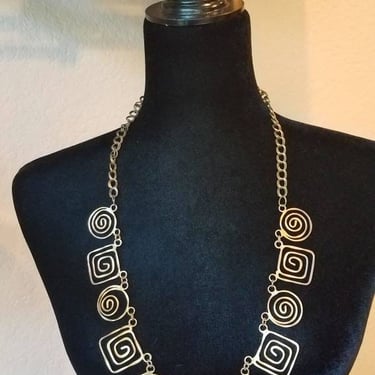 Brass swirl necklace long with unique hammered deco, 1970's 